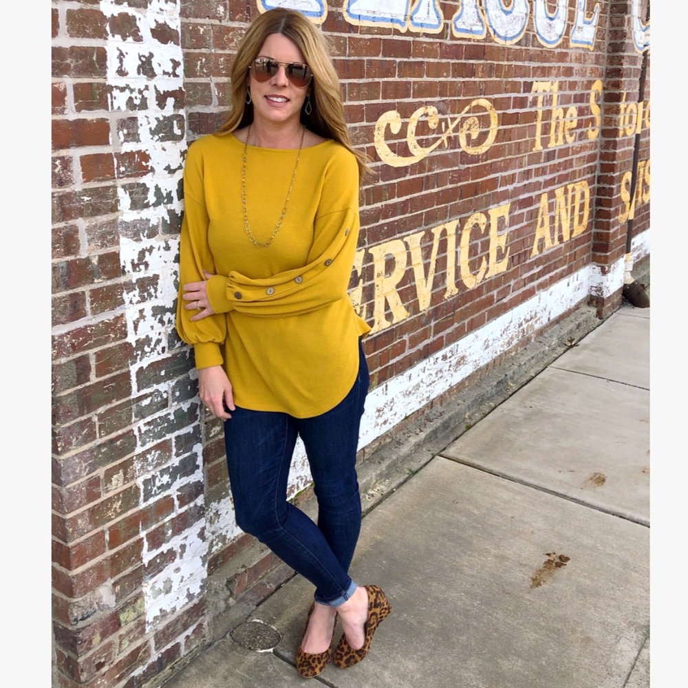 Super soft top, button detail down sleeve!